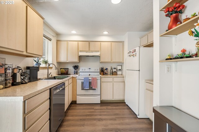 4000 NE 109th Ave Unit 169, Vancouver, WA 98682 - kitchen with white appliances, a sink, under cabinet range hood, light brown cabinets, and light countertops