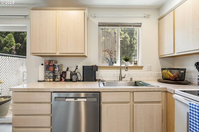 4000 NE 109th Ave Unit 169, Vancouver, WA 98682 - kitchen featuring stainless steel dishwasher, a sink, light brown cabinets, and healthy amount of natural light