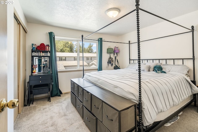 4000 NE 109th Ave Unit 169, Vancouver, WA 98682 - bedroom featuring light carpet and a textured ceiling