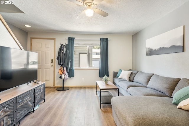 4000 NE 109th Ave Unit 169, Vancouver, WA 98682 - living room with a textured ceiling, light wood-style floors, a ceiling fan, baseboards, and recessed lighting