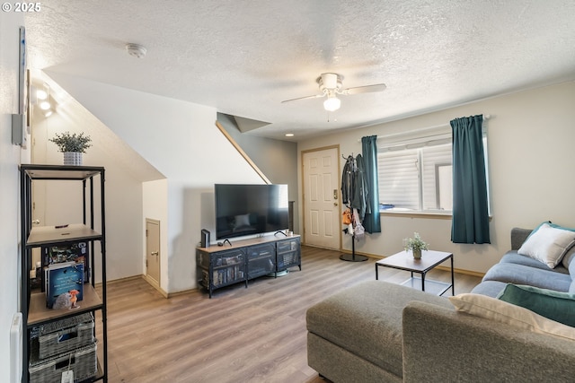 4000 NE 109th Ave Unit 169, Vancouver, WA 98682 - living room with a ceiling fan, light wood-style floors, a textured ceiling, and baseboards