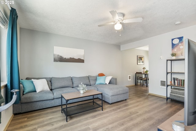 4000 NE 109th Ave Unit 169, Vancouver, WA 98682 - living area with ceiling fan, a textured ceiling, and light wood-style floors