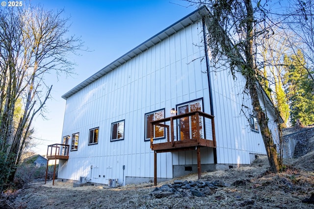 back of property featuring central AC unit