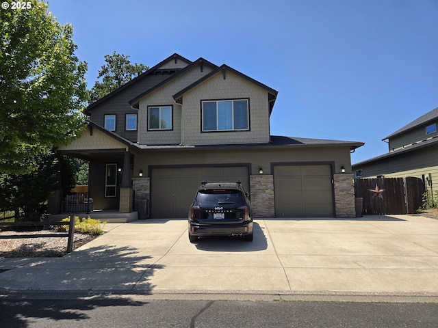 816 SW 4th Ave, Battle Ground, WA 98604 - craftsman-style home with driveway, stone siding, a garage, and a porch