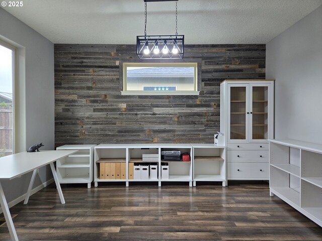 816 SW 4th Ave, Battle Ground, WA 98604 - dining space featuring an accent wall, wooden walls, and wood finished floors