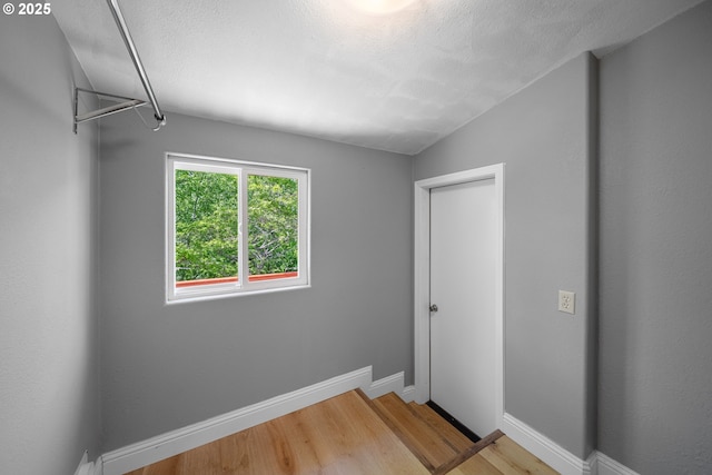 2111 Greenwood Ave, Reedsport, OR 97467 - unfurnished bedroom featuring light wood-style flooring and baseboards