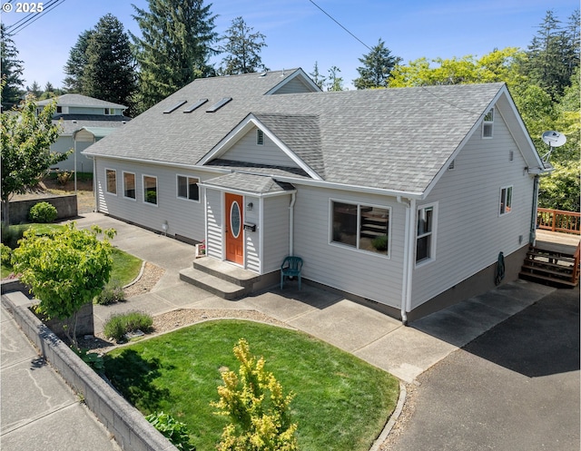 2111 Greenwood Ave, Reedsport, OR 97467 - view of front of house with roof with shingles and a front lawn