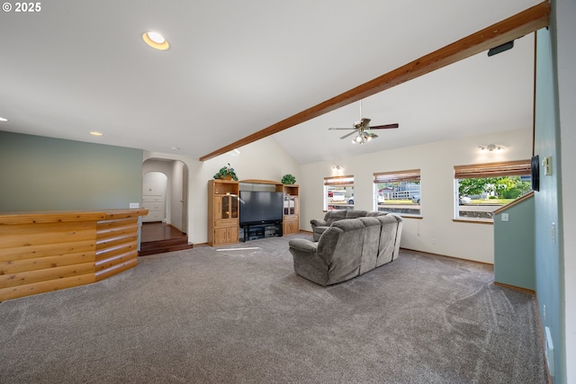 2111 Greenwood Ave, Reedsport, OR 97467 - carpeted living area with arched walkways, ceiling fan, recessed lighting, and baseboards