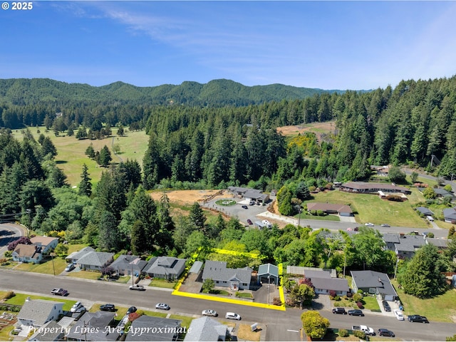 2111 Greenwood Ave, Reedsport, OR 97467 - view of property location with a forest, property parcel outlined, and mountains