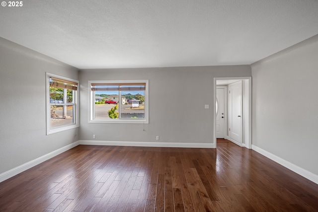 2111 Greenwood Ave, Reedsport, OR 97467 - unfurnished room with baseboards and dark wood finished floors