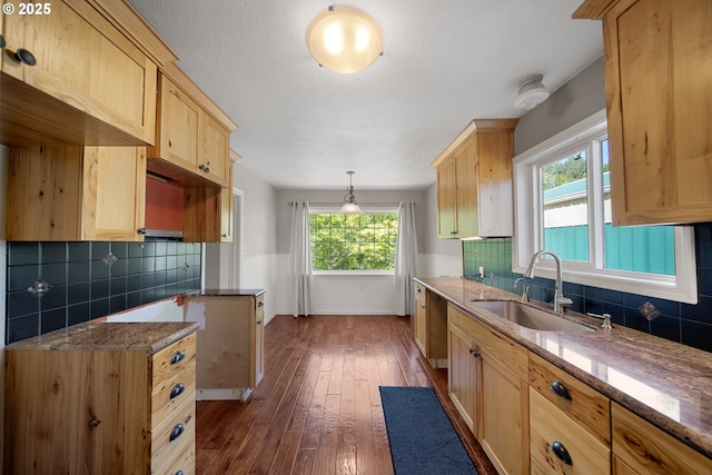 2111 Greenwood Ave, Reedsport, OR 97467 - kitchen featuring a sink, light brown cabinetry, stone counters, and backsplash