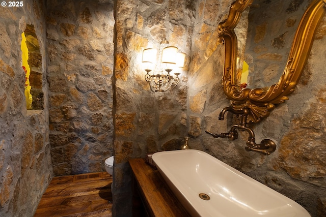 23021 Brushline Ct, Bend, OR 97701 - bathroom with wood finished floors and toilet