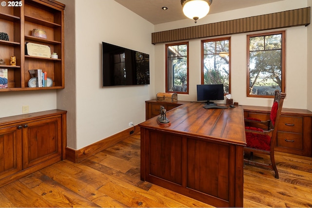 23021 Brushline Ct, Bend, OR 97701 - home office with wood-type flooring and baseboards
