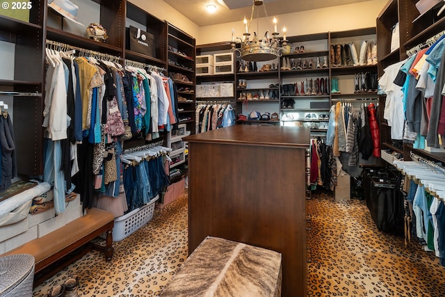23021 Brushline Ct, Bend, OR 97701 - walk in closet with tile patterned floors and a chandelier