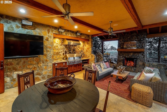 23021 Brushline Ct, Bend, OR 97701 - dining room featuring a ceiling fan, an outdoor stone fireplace, beamed ceiling, and recessed lighting