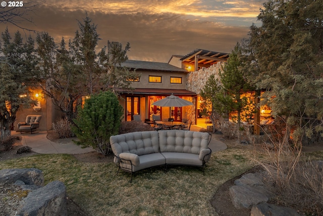 23021 Brushline Ct, Bend, OR 97701 - rear view of property with a patio, outdoor lounge area, a lawn, and outdoor dining area