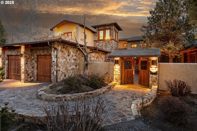 23021 Brushline Ct, Bend, OR 97701 - view of front of property with stone siding and stucco siding