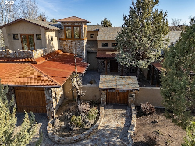 23021 Brushline Ct, Bend, OR 97701 - view of front of house with stone siding, french doors, and stucco siding