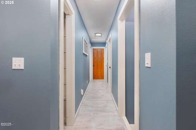 hallway featuring light wood-type flooring