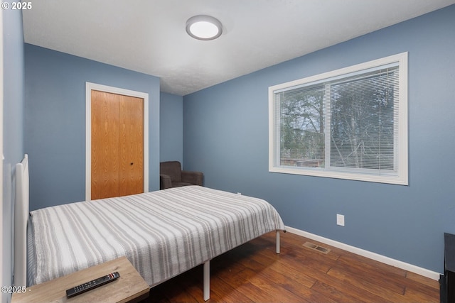 bedroom featuring wood-type flooring