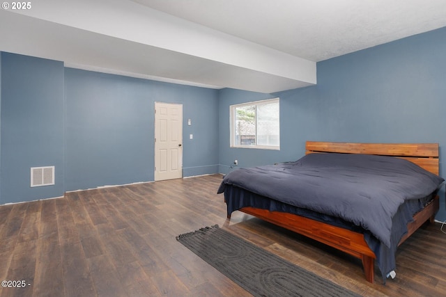 bedroom featuring dark hardwood / wood-style floors