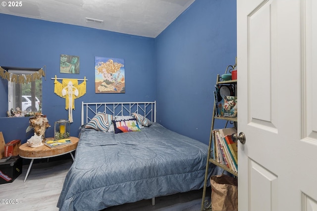 bedroom featuring hardwood / wood-style flooring