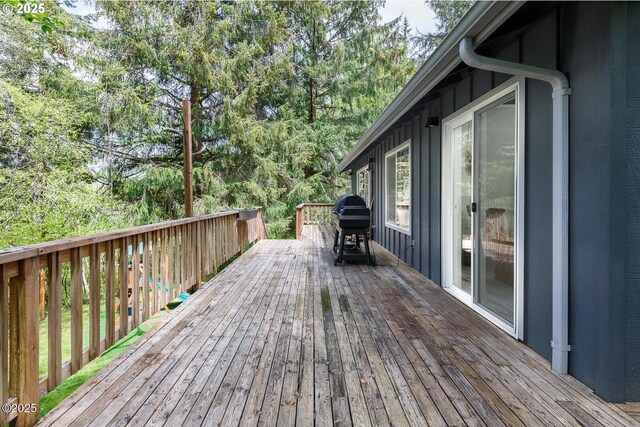 wooden terrace featuring grilling area