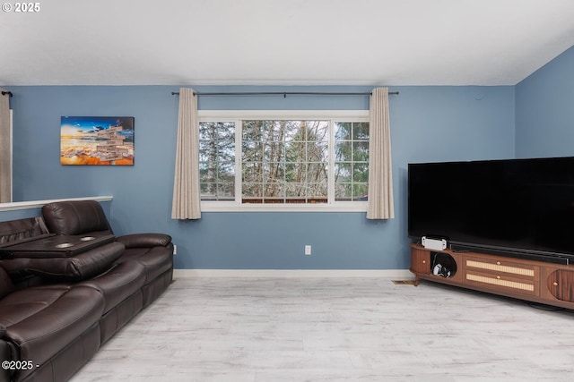 living room with light hardwood / wood-style flooring