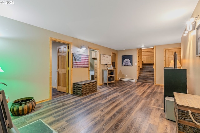10256 Ridgeview Ter, Birkenfeld, OR 97016 - living area featuring baseboard heating, stairway, wood finished floors, and baseboards