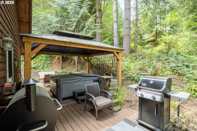 10256 Ridgeview Ter, Birkenfeld, OR 97016 - wooden terrace with a hot tub, a gazebo, grilling area, and a view of trees