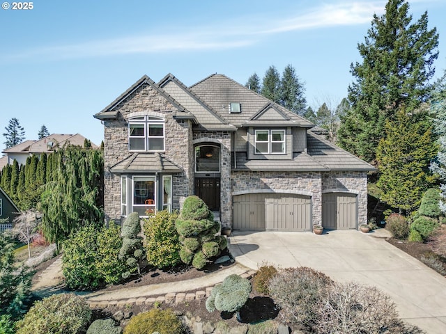 view of front facade featuring driveway and stone siding