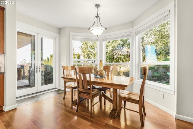 sunroom / solarium featuring french doors