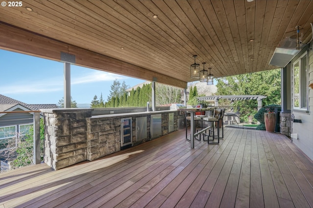 wooden terrace featuring a grill