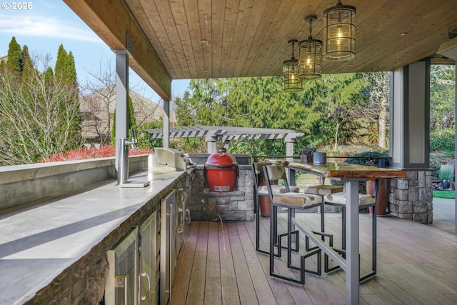 deck with beverage cooler and an outdoor kitchen