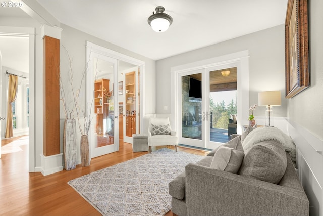 sitting room with wood finished floors and french doors