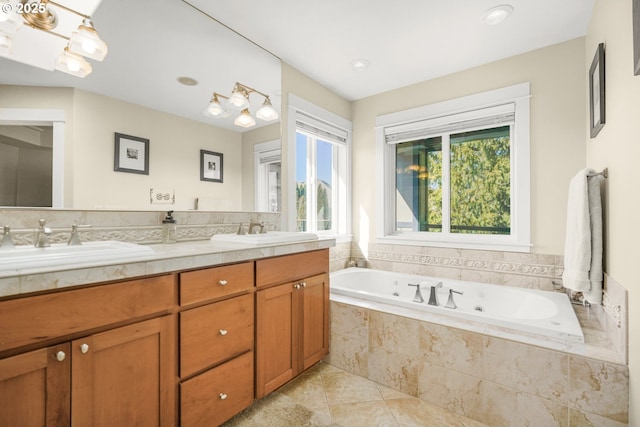 bathroom featuring a whirlpool tub, double vanity, tile patterned flooring, and a sink