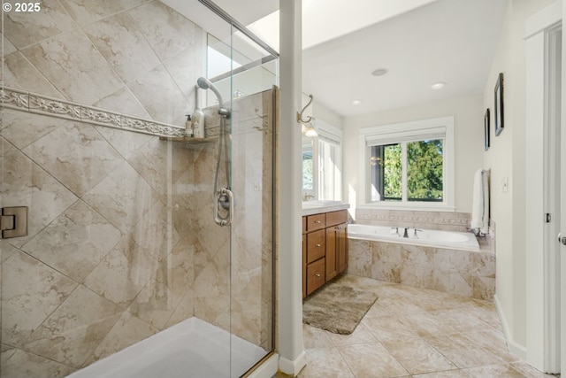 full bath with a garden tub, a stall shower, and vanity