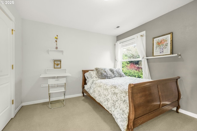 carpeted bedroom with baseboards