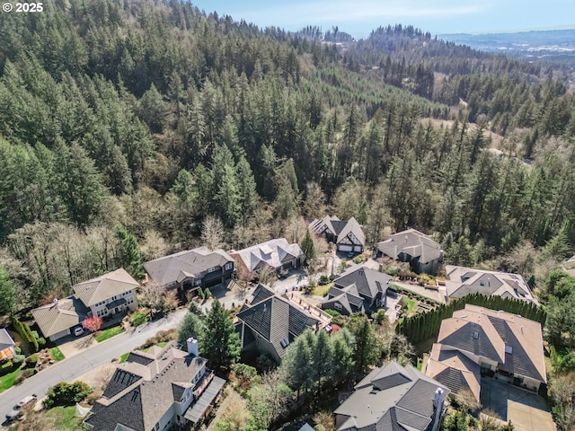 birds eye view of property featuring a residential view and a view of trees