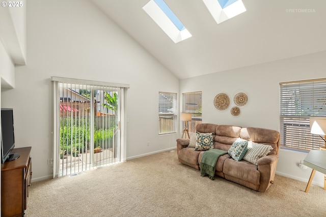 4744 SE Maxwell St, Hillsboro, OR 97123 - carpeted living area with high vaulted ceiling, a skylight, and baseboards