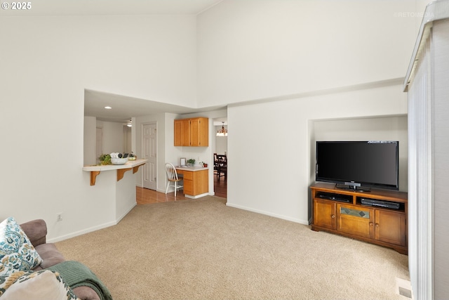 4744 SE Maxwell St, Hillsboro, OR 97123 - living area with light carpet, high vaulted ceiling, and baseboards