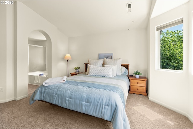 4744 SE Maxwell St, Hillsboro, OR 97123 - bedroom with carpet floors, arched walkways, baseboards, vaulted ceiling, and ensuite bathroom