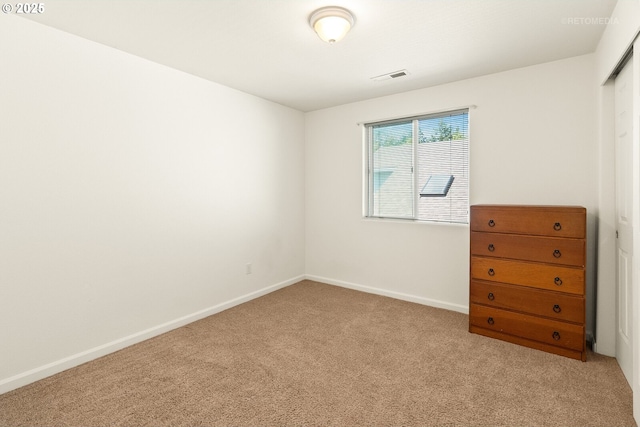 4744 SE Maxwell St, Hillsboro, OR 97123 - unfurnished bedroom featuring light colored carpet, baseboards, and a closet