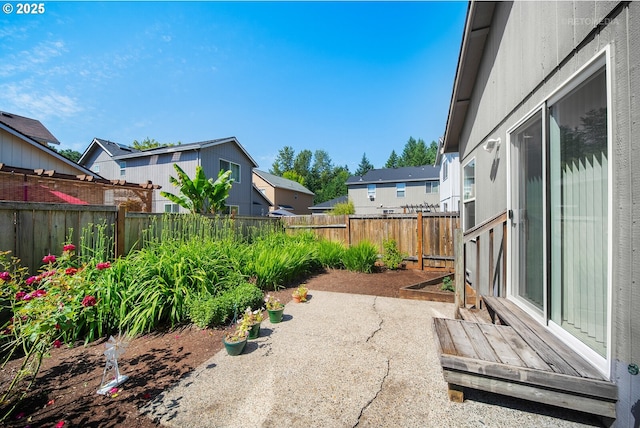 4744 SE Maxwell St, Hillsboro, OR 97123 - fenced backyard with a patio area and a residential view
