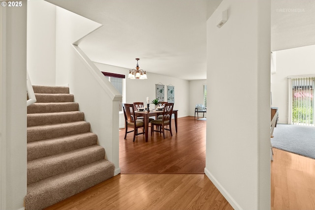 4744 SE Maxwell St, Hillsboro, OR 97123 - dining room with a chandelier, wood finished floors, plenty of natural light, and stairs