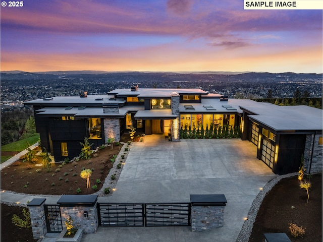 view of front of house featuring a garage and a mountain view