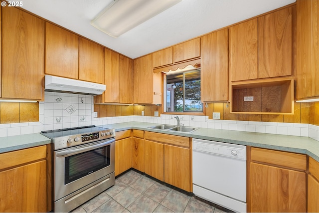 8095 Bewley St, Bay City, OR 97107 - kitchen with under cabinet range hood, dishwasher, stainless steel range with electric cooktop, a sink, and tasteful backsplash