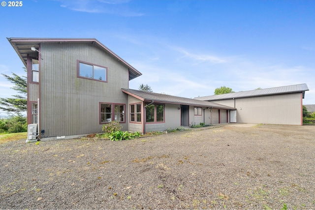 8095 Bewley St, Bay City, OR 97107 - back of property featuring a garage and driveway