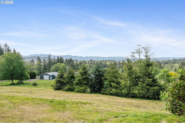 8095 Bewley St, Bay City, OR 97107 - view of mountain backdrop featuring rural landscape and a forest
