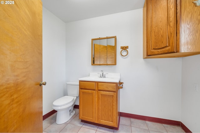 8095 Bewley St, Bay City, OR 97107 - bathroom featuring toilet, vanity, baseboards, and tile patterned floors